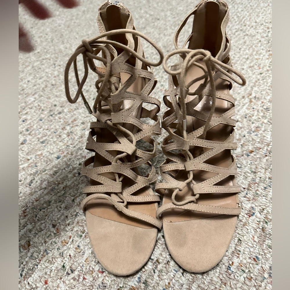 Cute laced heels. Never worn. Size 10